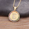 Gold-plated round letter E pendant necklace with colorful cubic zirconia rainbow border - Letter E