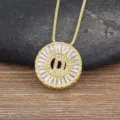 Gold-plated brass initial D necklace featuring sparkling cubic zirconia stones in a round halo design. - Letter D