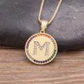 Gold-plated brass initial M pendant necklace with colorful cubic zirconia border and box chain. - M