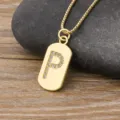 Gold initial P pendant necklace featuring sparkling cubic zirconia on a chic metal tag. - Letter P