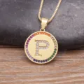 Gold-plated brass coin pendant necklace featuring a micro-pave white and colorful zirconia letter P. - Letter P