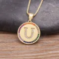 Gold-plated letter U pendant necklace featuring colorful cubic zirconia stones for women. - Letter U