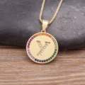 Gold-plated brass necklace featuring a round pendant with colorful cubic zirconia and letter Y. - Letter Y