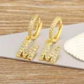 Gold letter M hoop earrings with sparkling cubic zirconia, elegant daily wear jewelry. - M