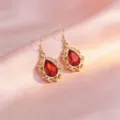 Orecchini pendenti vintage stile corte gocce rosse dorate variante modello gioiello - Orecchini / Rosso
