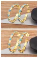 Gold plated evil eye hoop earrings with cubic zirconia heart and star designs for women. - Heart / Light Blue