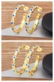 Gold plated evil eye hoop earrings with sparkling zirconia and heart pentagram design for women. - White