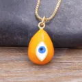 Gold plated evil eye necklace featuring a vibrant orange waterdrop pendant and delicate box chain. - Orange (N628)