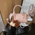 Pink cylinder handbag for women, stylish pillow shoulder bag with cute plush bear pendant charm. - With Pendant / Pink