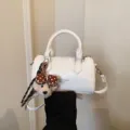 White patent leather barrel bag with cute brown polka dot bow bear pendant for summer style - White
