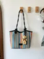 Stylish colorful woven straw tote bag with black handles and cute bear pendant for summer beach. - Style 2 (Rainbow Stripes) / With Pendant / Black
