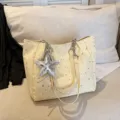 Light yellow canvas tote bag with silver star print, chain strap and star pendant for daily use. - Yellow