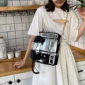 Retro Telefon Form Umhängetasche, kreative Neuheit PU Leder Schultertasche für Damen. - Schwarz