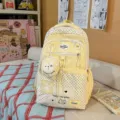 Detailed view of cute yellow polka dot school backpack with adorable coin purse and sweet style. - No Pendant / Yellow