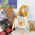 Leinwand Eimer Tasche mit gelbem Griff, süßem Smiley Druck und Schultergurt für den täglichen Gebrauch. - Gelb
