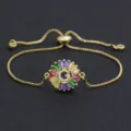 Gold-plated initial letter G slider bracelet with colorful baguette cubic zirconia stones. - Letter G