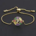 Gold plated initial P bracelet with colorful baguette cubic zirconia stones, adjustable size. - Letter P