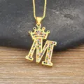Gold-plated letter M crown pendant necklace featuring vibrant multi-color cubic zirconia stones. - Letter M