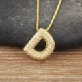 Gold D letter pendant necklace with sparkling cubic zirconia stones and delicate box chain. - Letter D