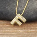 Gold plated letter F pendant necklace featuring micro pave cubic zirconia stones on chain. - Letter F