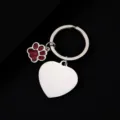 Stainless steel metal keychain detail view featuring a blank heart tag and red glitter dog paw. - Heart Tag (30mm) with Red Glitter Dog Paw / Silver