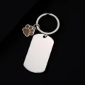 Stainless steel dog tag keychain with cute brown glitter paw pendant, metal keyring detail view. - Military Tag (50X28mm) with Gold Glitter Dog Paw / Silver