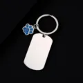 Stainless steel dog tag keychain with blue glitter paw charm, ideal for custom laser engraving. - Military Tag (50X28mm) with Blue Glitter Dog Paw / Silver