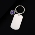Stainless steel military dog tag keychain with cute purple glitter paw pendant, detail view. - Military Tag (50X28mm) with Purple Glitter Dog Paw / Silver