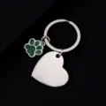 Stainless steel metal keychain featuring a green glitter paw charm and a blank heart tag. - Slanted Heart Shape with Green Glitter Dog Paw / 30x28.5mm / Silver