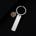 Stainless steel keychain detail showing blank metal tag and glitter paw charm for custom engraving. - Rectangle Bar (50X12mm) with Gold Glitter Dog Paw / Silver