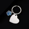 Stainless steel blank heart pendant keychain with blue glitter paw charm detail close up view - Slanted Heart Shape with Blue Glitter Dog Paw / 30x28.5mm / Silver