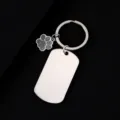 Close-up detail of stainless steel military tag keychain with cute glitter paw charm. - Military Tag (50X28mm) with Gray Glitter Dog Paw / Silver