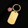 Stainless steel golden dog tag keychain with pink glitter paw charm detail close up view - Military Tag (50X28mm) with Pink Glitter Dog Paw / Gold
