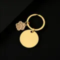 Goldener Edelstahl Schlüsselanhänger mit Glitzer Hunde Pfote Anhänger und runder Plakette. - Gold Basis Goldene Pfote / 30mm Rund