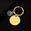 Goldener Metallschlüsselanhänger mit blanker runder Scheibe und blauem Glitzerpfotenanhänger. - Gold Basis Blaue Pfote / 30mm Rund