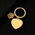 Close-up detail of gold metal keychain with glitter paw charm and blank heart tag for DIY. - Heart Shape with Glitter Gold Dog Paw / 1 Piece (30mm) / Gold