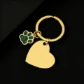 Close-up of golden keychain with green glitter paw print and blank heart metal pendant. - Slanted Heart (30*28.5mm) with Green Glitter Dog Paw / Gold