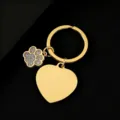 Close-up detail of golden stainless steel keychain with glitter dog paw and heart blank charm. - Heart Shape with Gray Glitter Dog Paw / 30mm / Gold