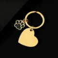 Gold stainless steel blank heart and glitter paw print keychain detail view for custom engraving. - Slanted Heart (30*28.5mm) with Black Glitter Dog Paw / Gold