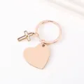 Detail view of rose gold stainless steel heart and cross keychain blank pendant for engraving. - 30mm Heart Cross Style / Rose Gold