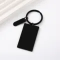 Detail shot of blank black rectangular stainless steel metal keychain for DIY engraving. - 45x27mm Rectangle + Small Oval + Key Ring / Black