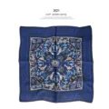 Detailed view of the blue luxury silk scarf featuring intricate animal and botanical patterns. - 53x53cm / Dark Blue