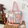 Student canvas shoulder bag detail, color block tote with multiple front pockets and charms. - Bag + Pom-Pom Badge / Light Blue