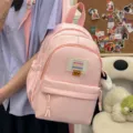 Zaino mini rosa carino per donna, zainetto casual per la scuola con toppa frontale. - Borsa Singola / Rosa