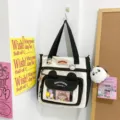 Segeltuch Tragetasche mit klarer Fronttasche, Panda Schlüsselanhänger und Bärenohren Design. - Mit Plüschanhänger / Schwarz