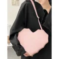 Pink heart-shaped crossbody bag with unique spiderweb stitching, sweet and cool gothic style. - Pink