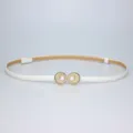 Elegant white thin leather belt featuring a chic pearl and shell buckle detail for dresses. - White