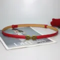 Women skinny red PU leather belt with vintage metal buckle, stylish dress waist accessory. - Red