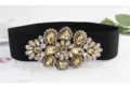 Elegant women's black elastic waist belt featuring a stunning large crystal rhinestone buckle. - 78cm / Champagne