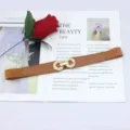 Women's brown elastic waist belt with metal double ring buckle, stylish dress accessory. - Camel